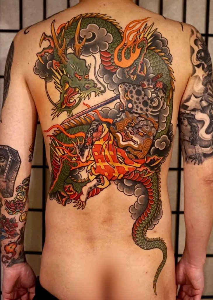 Dragon vs Toad tattoo back piece done by Uncle Baki (1)