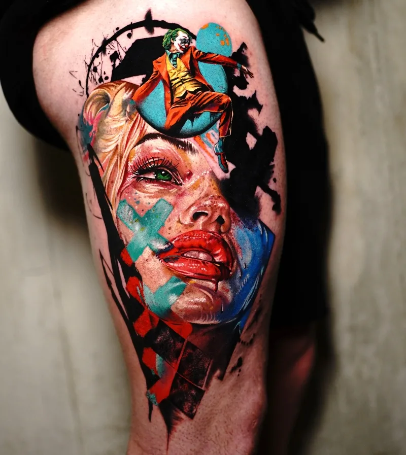 Joker on top of Harley Quinn leg tattoo done by Ina Lutaric